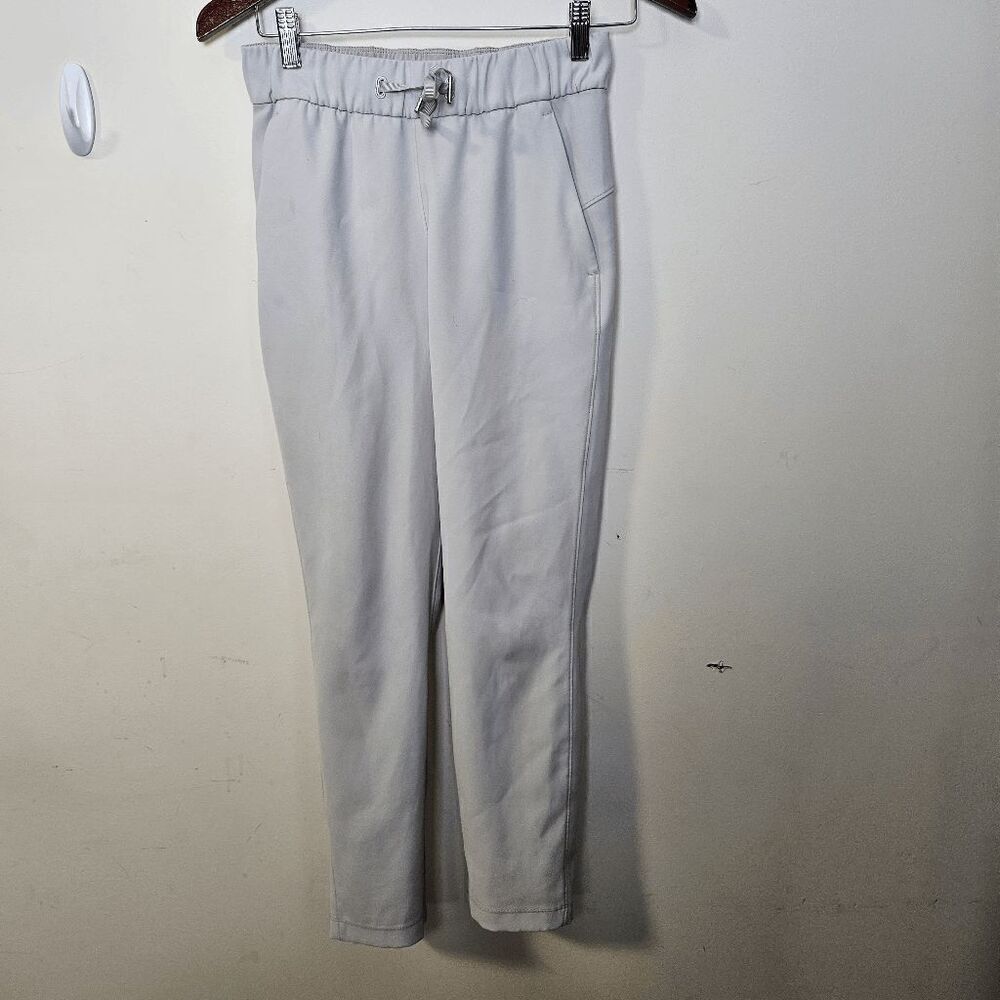 Lululemon On the Fly 7/8 Pants Woven 27" Womens Light Tan Size 2